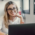 Registered migration agent reviewing Subclass 482 Skills in Demand sponsorship visa requirements with an Australian employer in a Sydney office