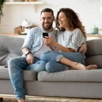 A couple reviewing partner visa documents at home, representing the onshore Subclass 820 application process in Australia 2026