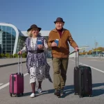 Older parents arriving at an Australian airport to reunite with adult children on a parent visa